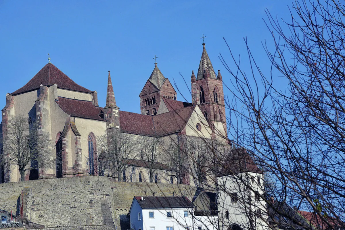 Riquewihr medieval village street with Christmas market stalls and traditional architecture