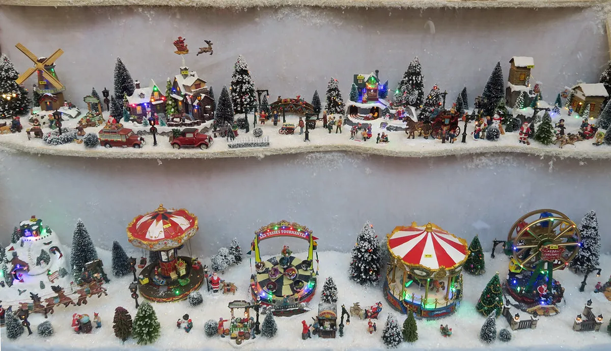 Strasbourg Christmas market at night with illuminated wooden chalets and festive lights