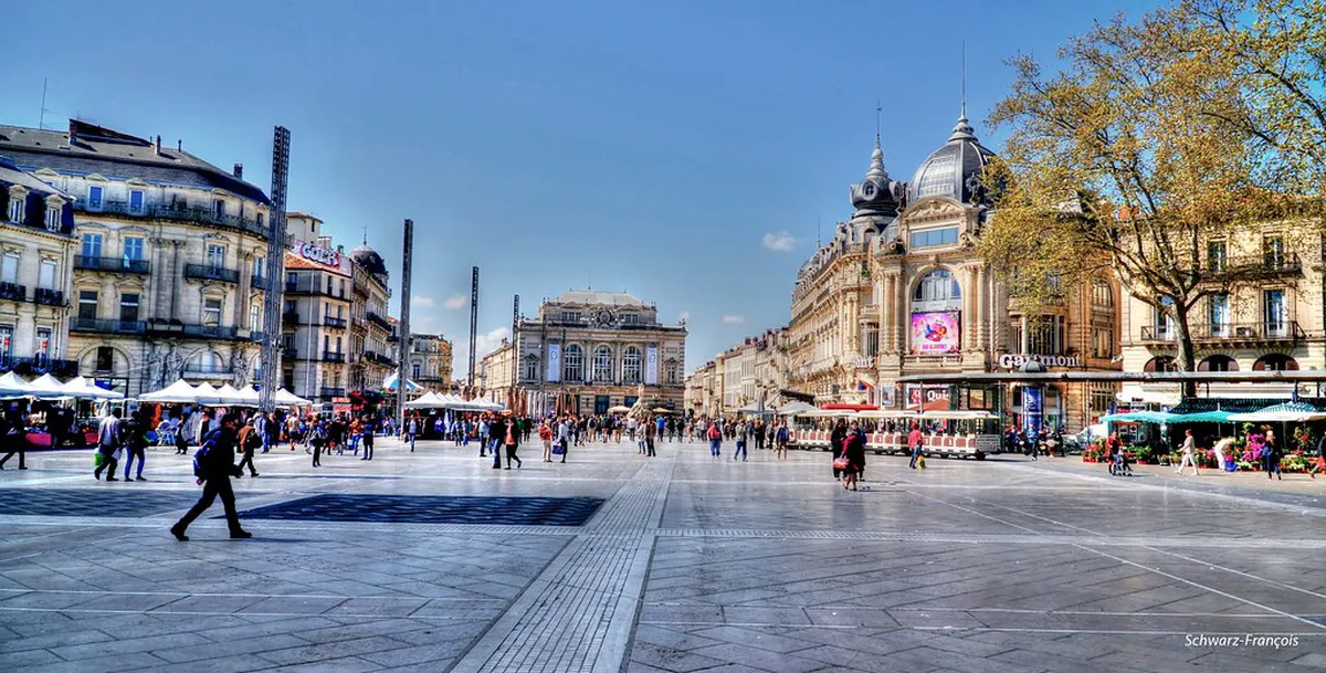 Place de la Comédie in Montpellier with the Three Graces fountain and the Opéra Comédie behind café terraces