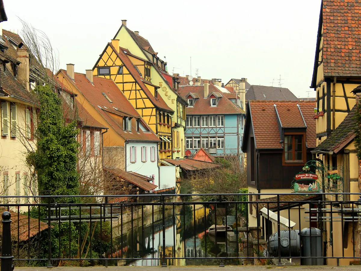 Colmar Old Town pastel half-timbered houses reflected in the Lauch River