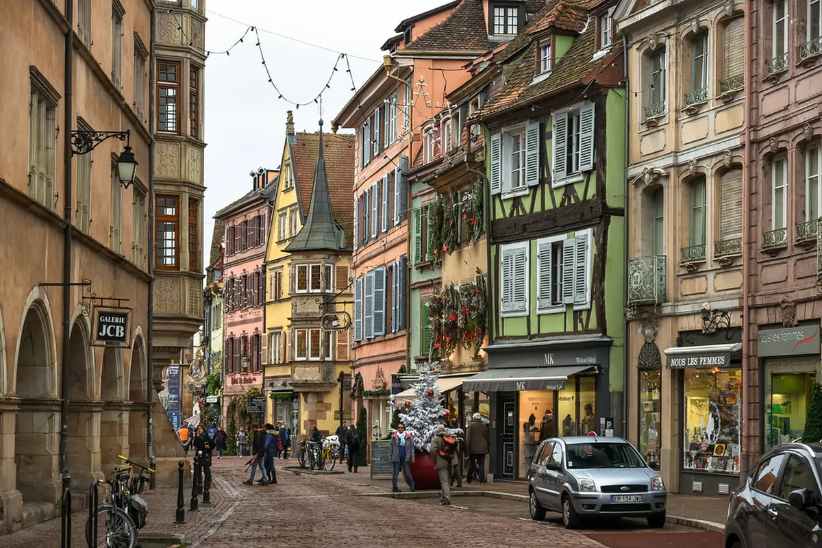 Colmar parking garage entrance and modern parking structure with vehicles