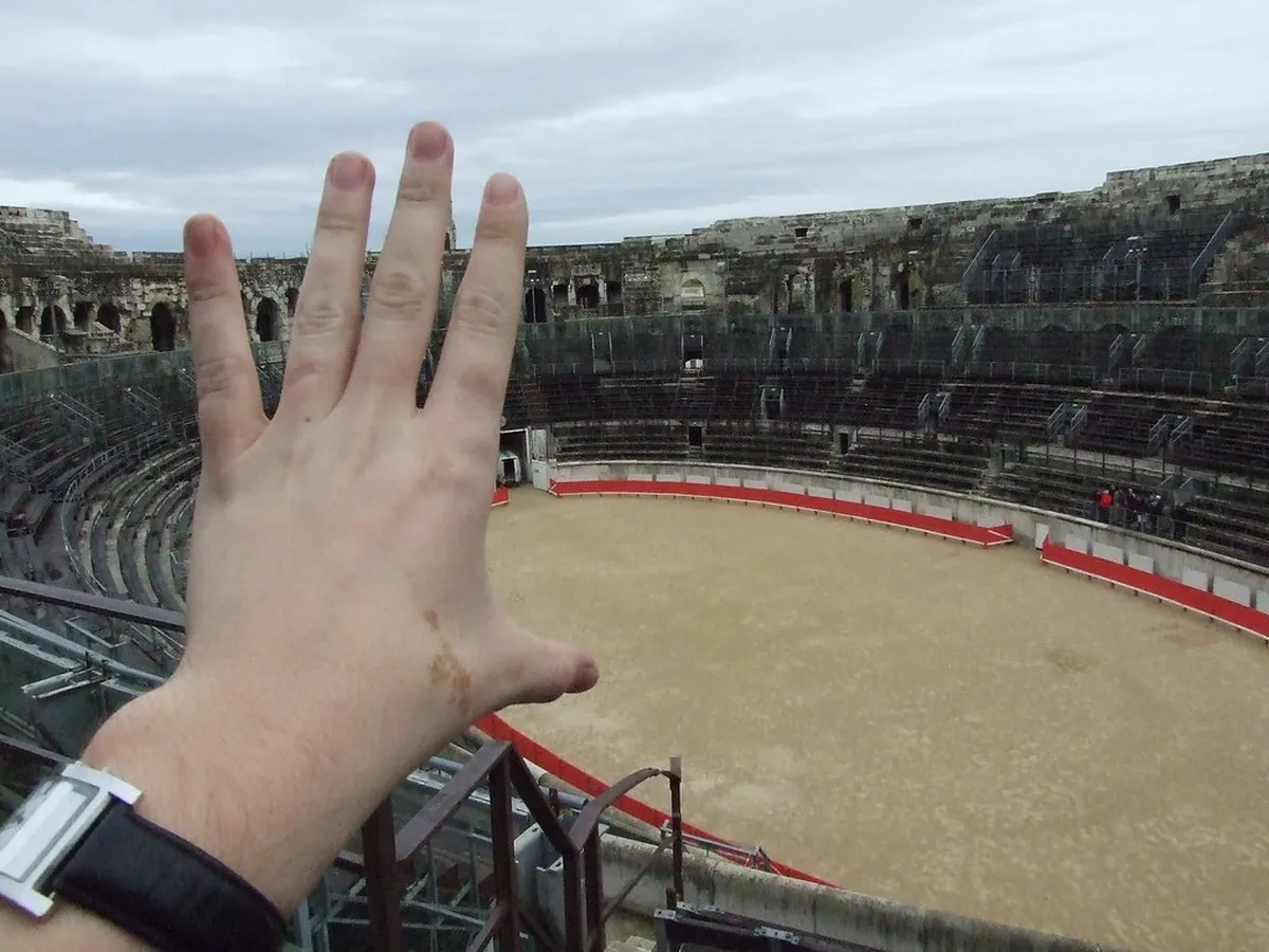Ancient Roman amphitheater in Nîmes with arched stone architecture