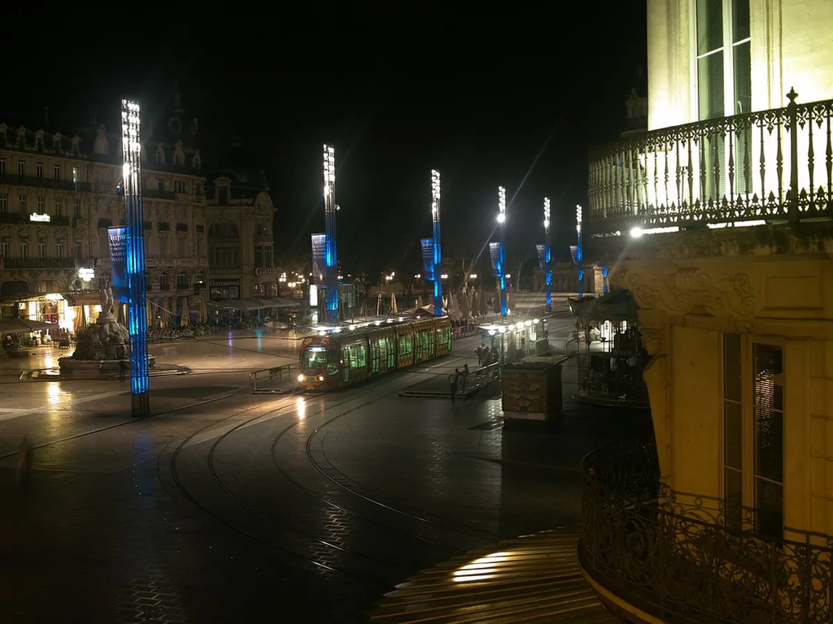 Montpellier evening street scene with night lighting and city nightscape