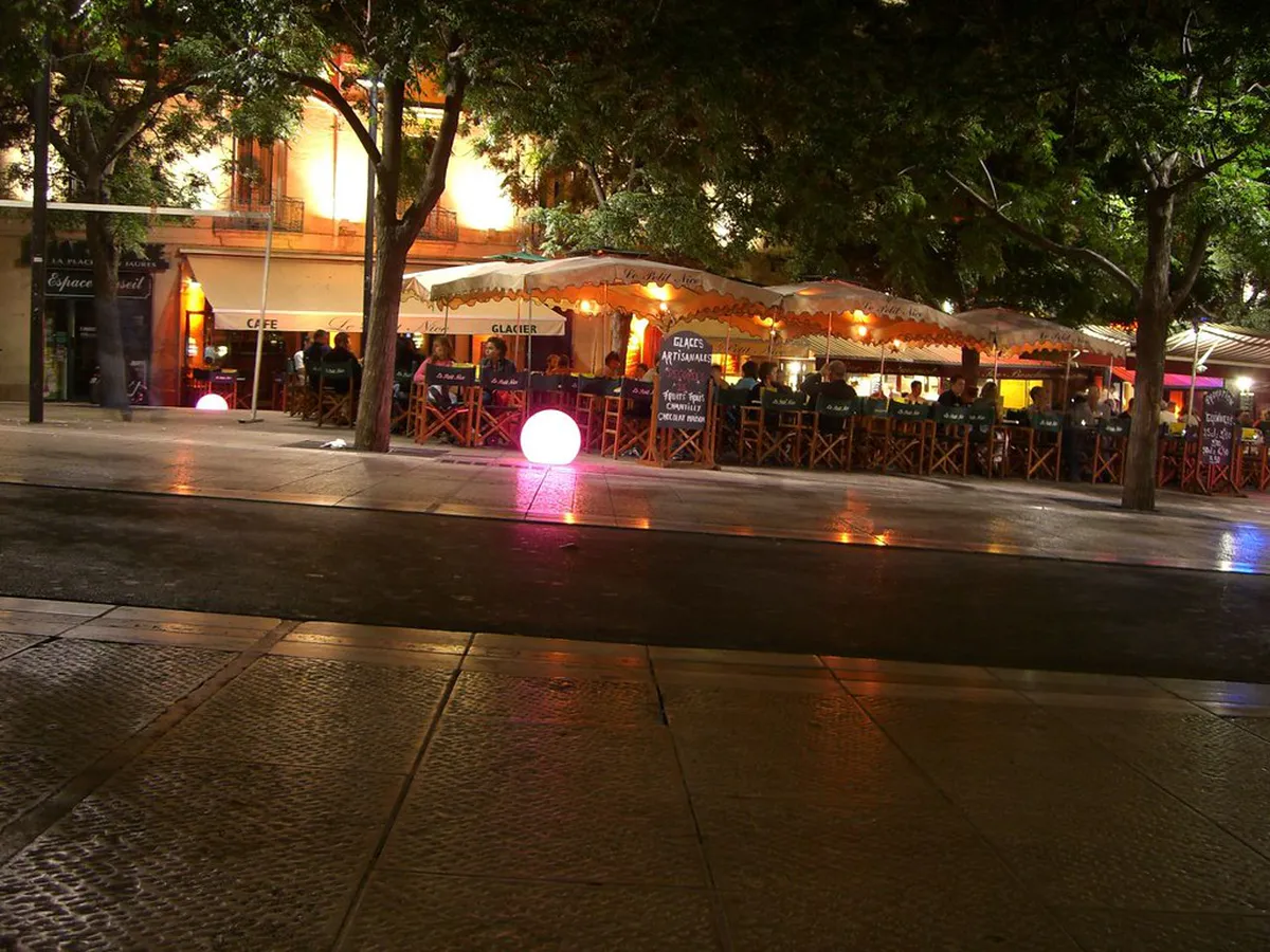 Montpellier street at night with historic buildings and evening lights