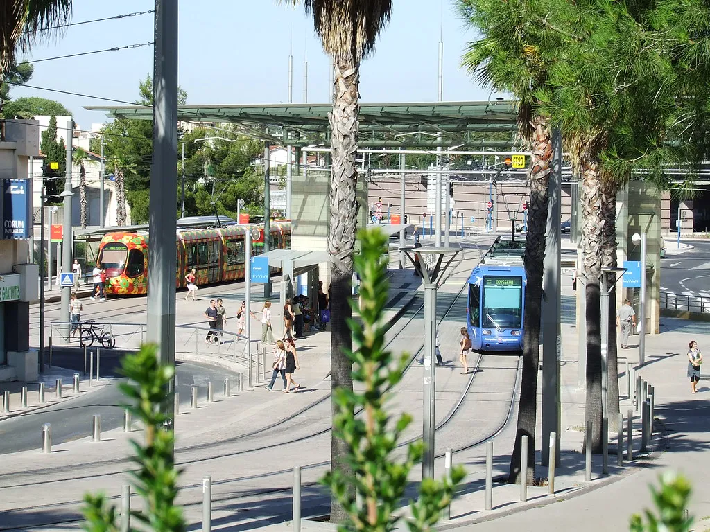 View of the city tram gliding past pedestrian streets in Montpellier, southern France