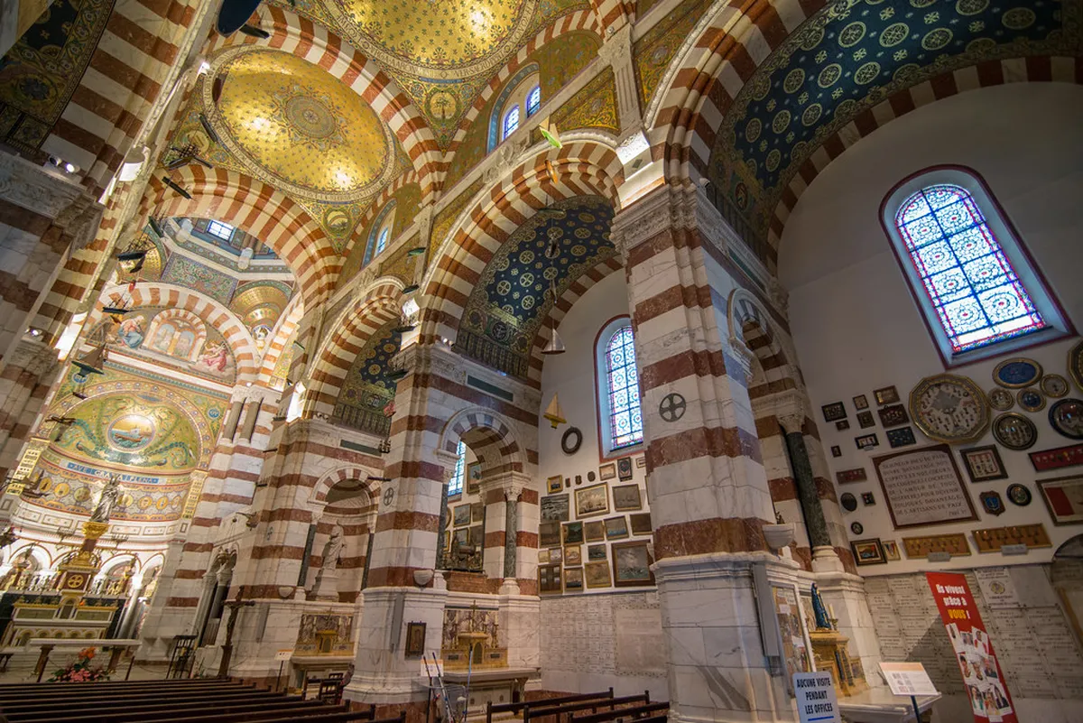 Interior chapel of Notre-Dame de la Garde basilica with ornate religious decorations