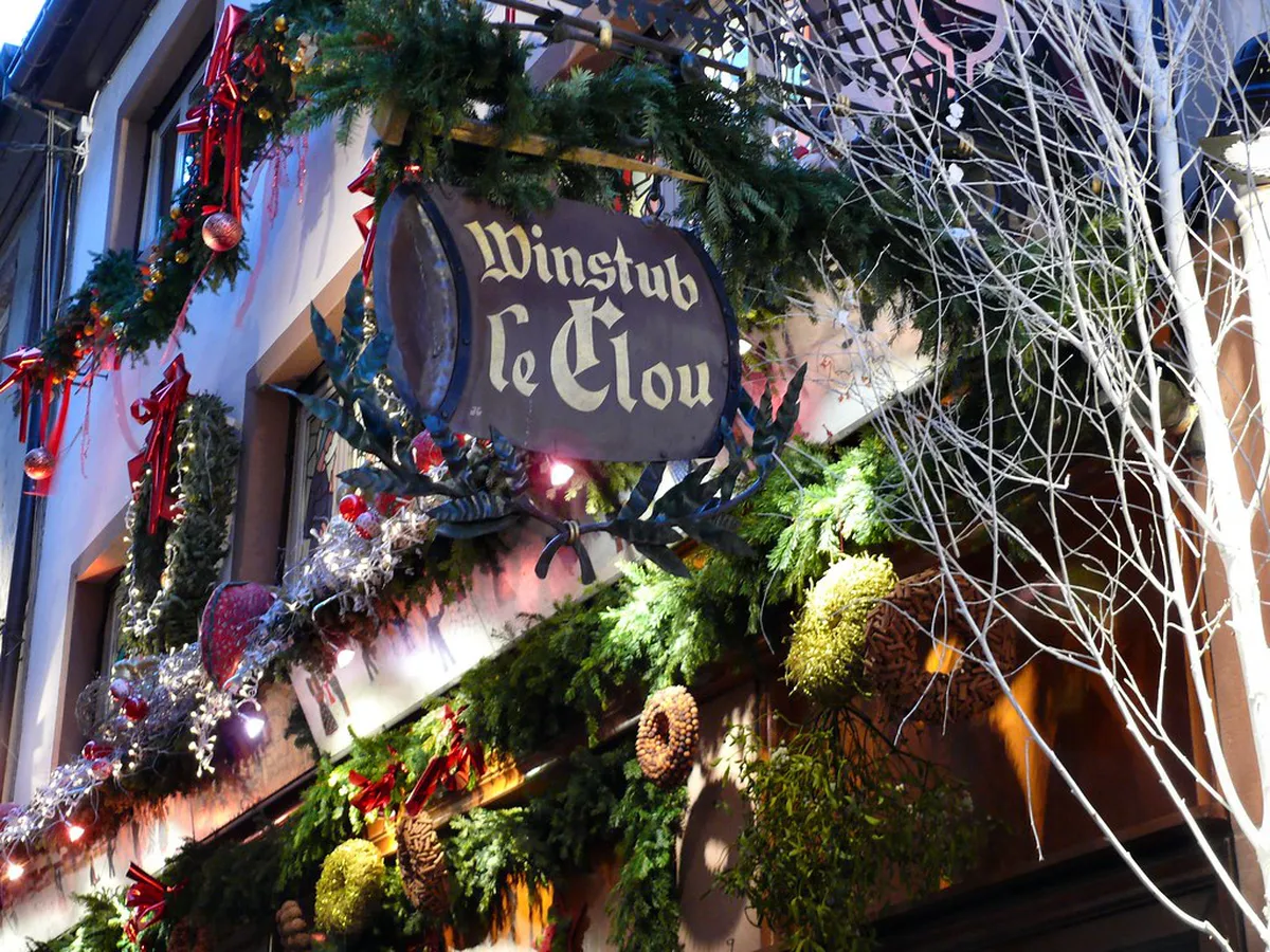 Traditional Alsatian winstub interior with wine and local Alsatian cuisine